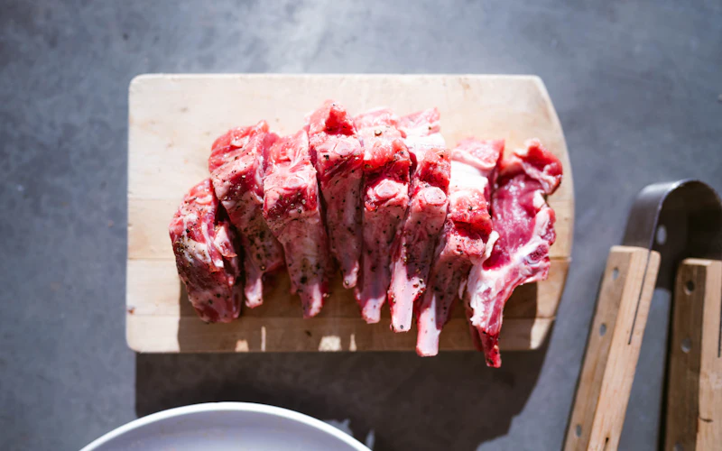 Raw rack of lamb on a cutting board